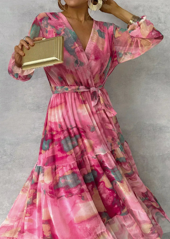 Close-up of floral wrap maxi dress bodice featuring V-neckline and abstract print pattern
