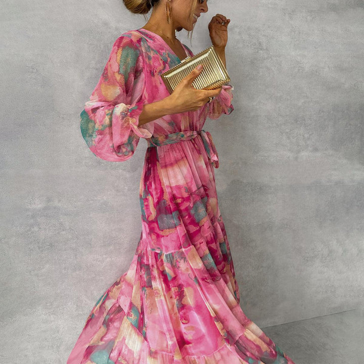 Full-length view of floral wrap maxi dress with gathered sleeve cuffs and ruffled tier seams
