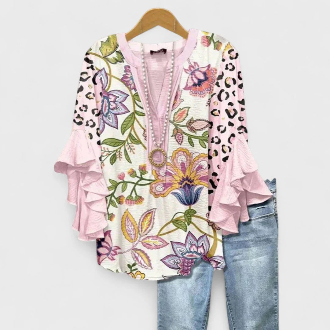 Women's casual floral blouse with elbow-length ruffle sleeves styled for everyday wear