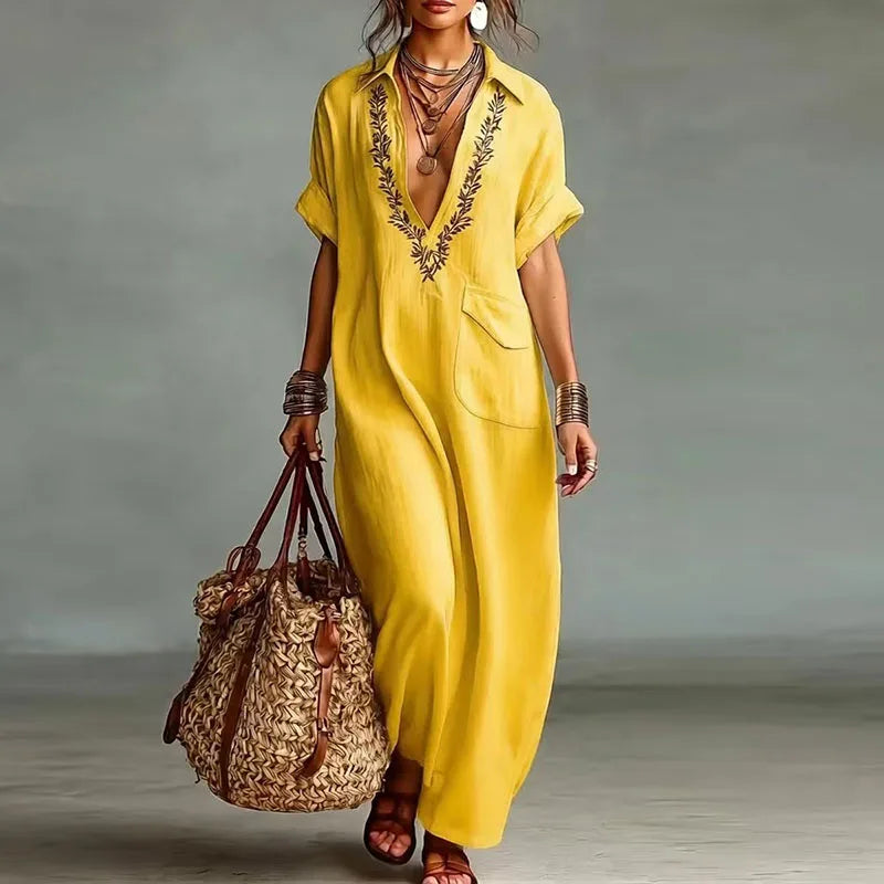 Side view of flowing maxi kaftan dress with chest pocket and loose fit silhouette