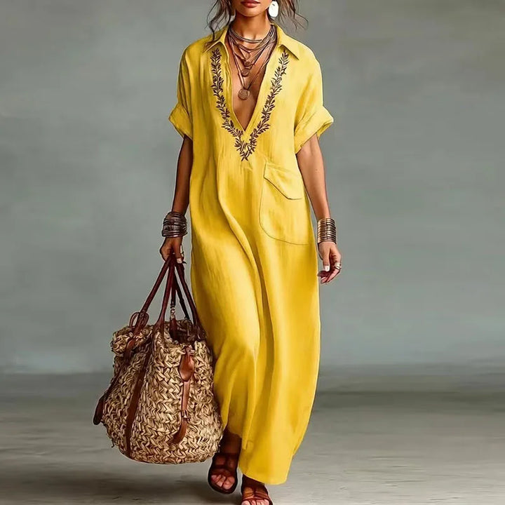 Side view of flowing maxi kaftan dress with chest pocket and loose fit silhouette