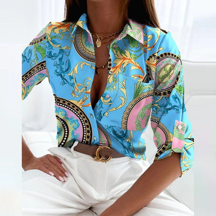 Classic collared blouse in blue geometric print showing relaxed fit through body
