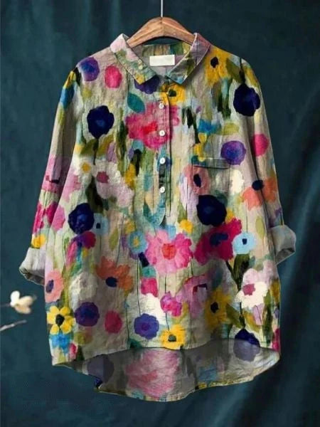 Women's abstract floral shirt showing sleeve cuff and button detail