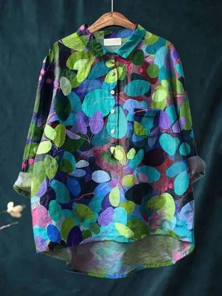 Women's collared shirt with artistic floral print in pink and green tones