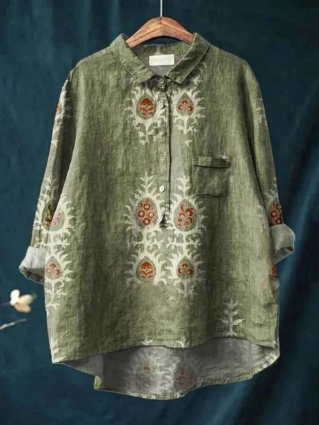 Women's abstract floral shirt showing curved hem and button closure