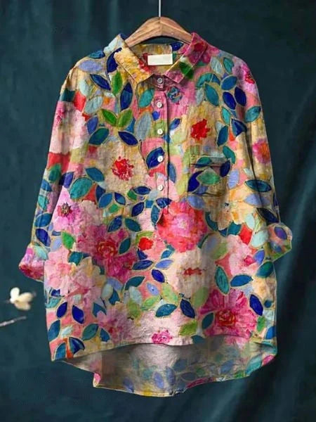Women's abstract floral shirt displayed flat showing relaxed fit and long sleeve design