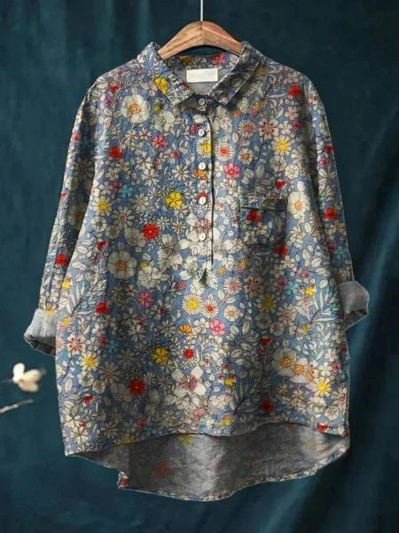 Side view of women's button-front shirt with curved hem and floral print pattern