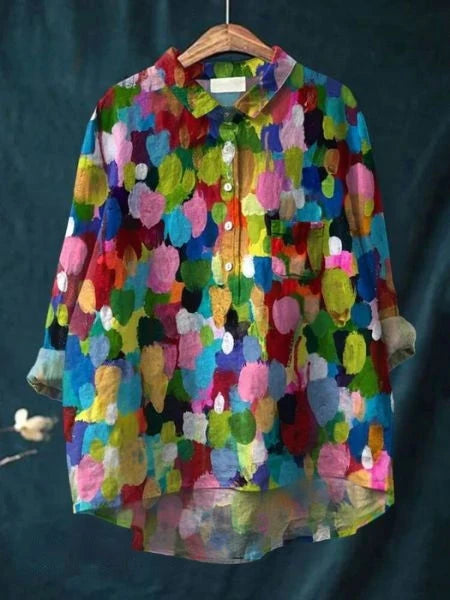 Women's relaxed fit shirt with vibrant floral print and button closure detail