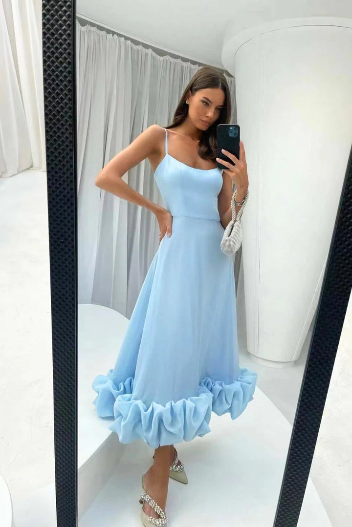 Full silhouette of flared skirt maxi dress with ruffle hem and fitted bodice construction
