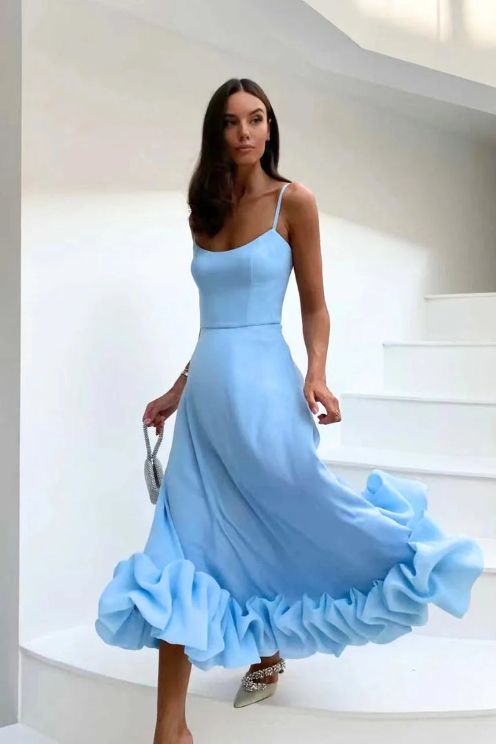 Maxi dress with spaghetti straps and gathered ruffle hem detail at floor-length hemline