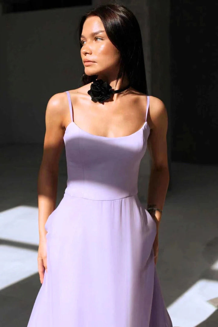 Floor-length maxi dress with flared skirt and gathered ruffle hem styled with heeled sandals
