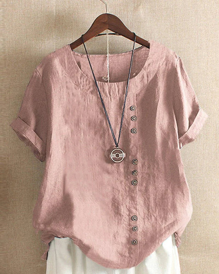 Relaxed fit linen summer blouse in dusty rose with rolled cuffs and asymmetric button detail on hanger
