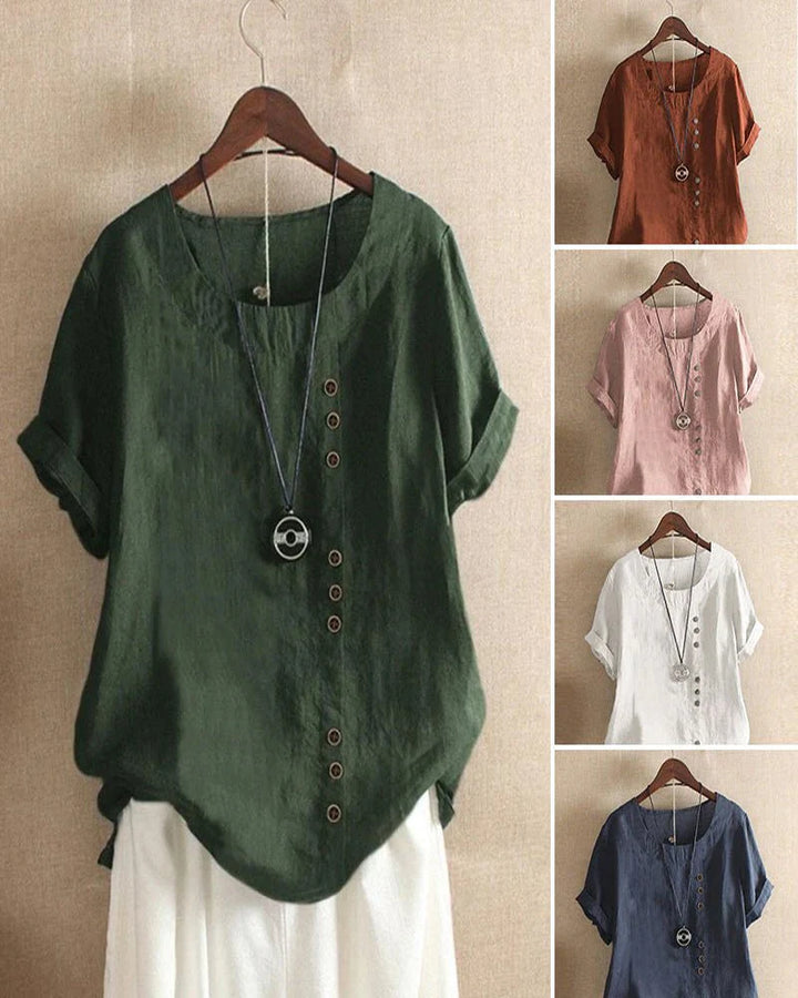 Full front view of dusty rose linen blouse with rolled short sleeves and button accents