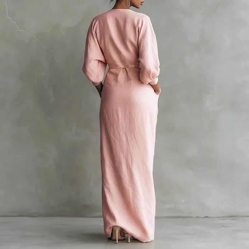 Front view of wrap waist long dress showing deep V neckline and front slit detail