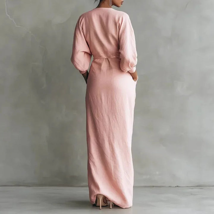 Front view of wrap waist long dress showing deep V neckline and front slit detail