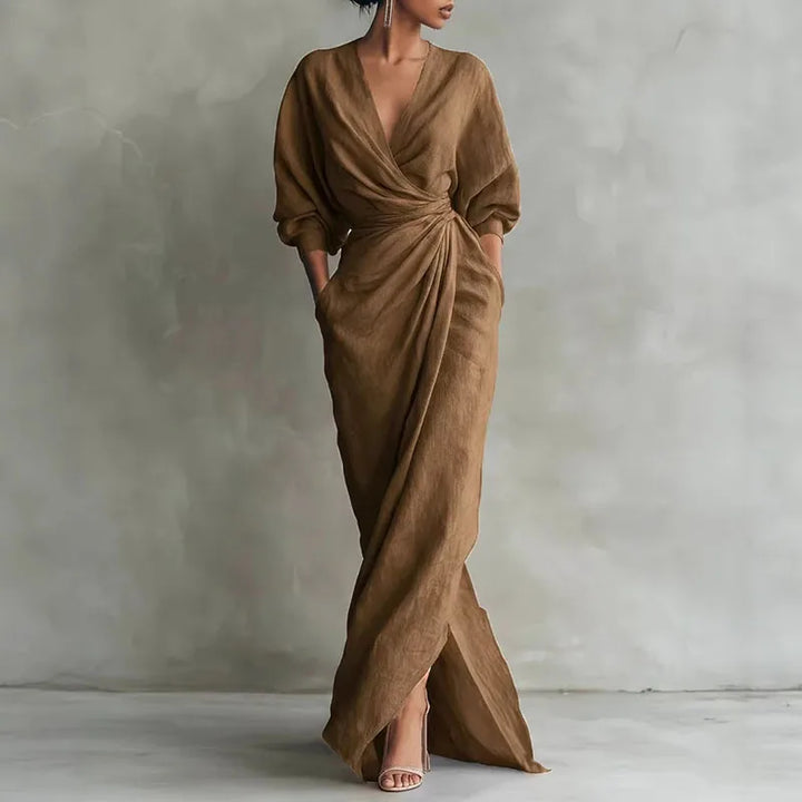 Side angle of V neck long dress highlighting wrap waist shaping and bodycon fit