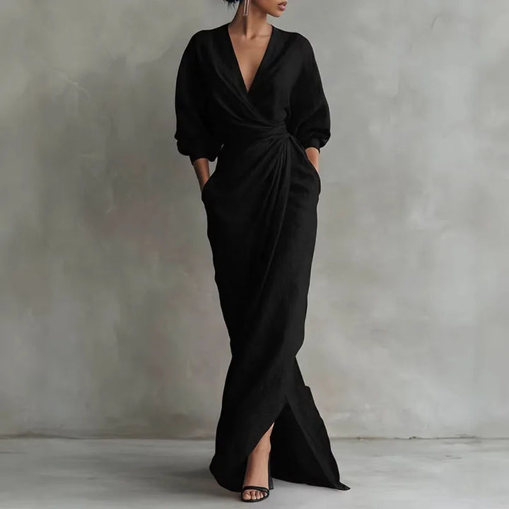 Full-length view of pink wrap dress with floor-length hem and structured drape