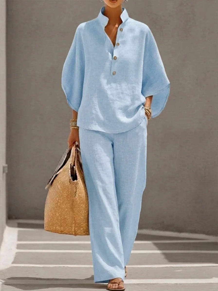 Side view showing relaxed fit of linen blend shirt and flowing wide-leg pants