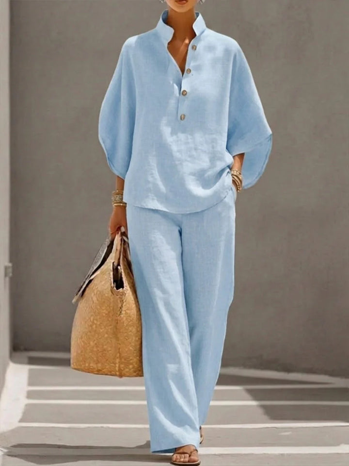 Side view showing relaxed fit of linen blend shirt and flowing wide-leg pants