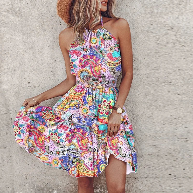 Full-length view of flowy halter neck summer mini dress with colorful printed pattern and mid-thigh length