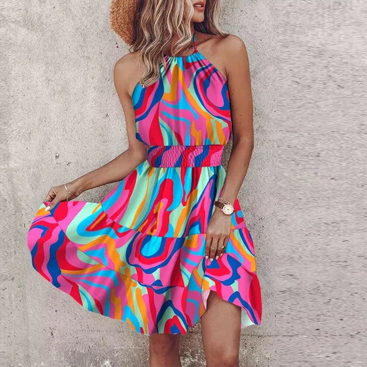 Back view of open back design with tie closure on vibrant printed halter summer mini dress