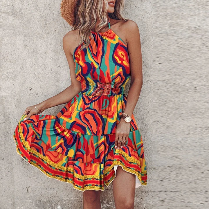 Close-up of halter neckline and printed bodice detail on summer mini dress with geometric motifs