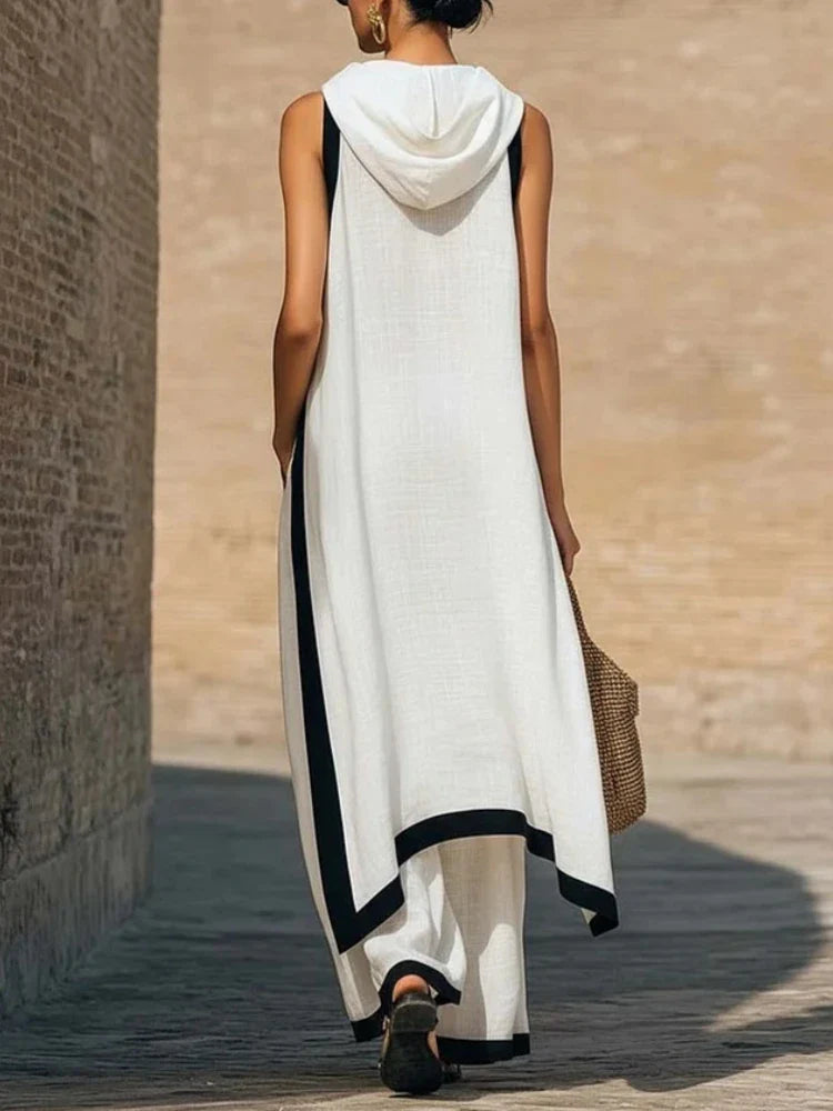 Side view of two piece linen set showing draped top silhouette and relaxed wide leg pants