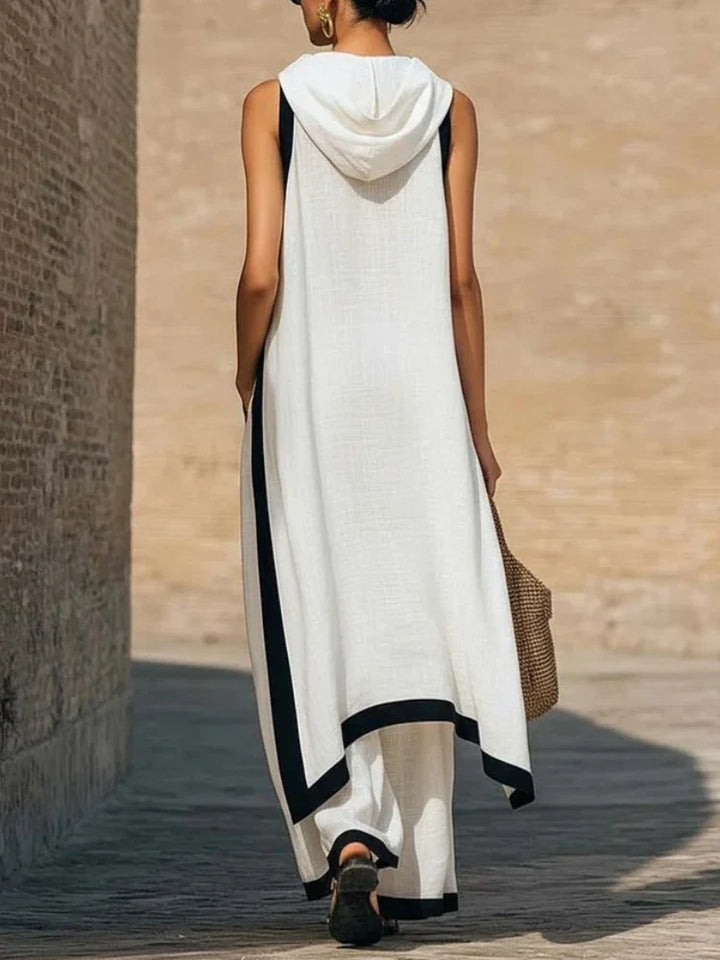 Side view of two piece linen set showing draped top silhouette and relaxed wide leg pants