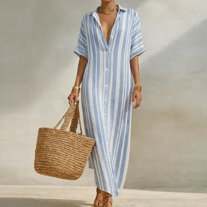 Detail of woven fabric texture and short sleeve construction on casual long shirt dress