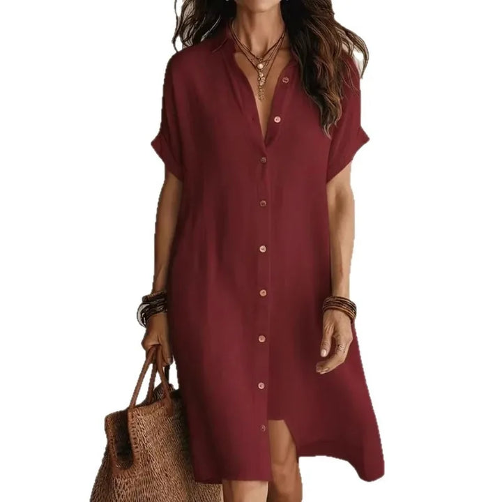 Full-length view of button down shirt dress in black with relaxed silhouette and short sleeves