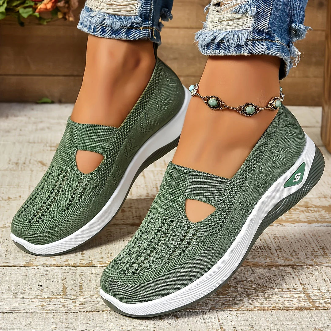 Side profile of women's platform sneakers with rocker sole and slip-on design
