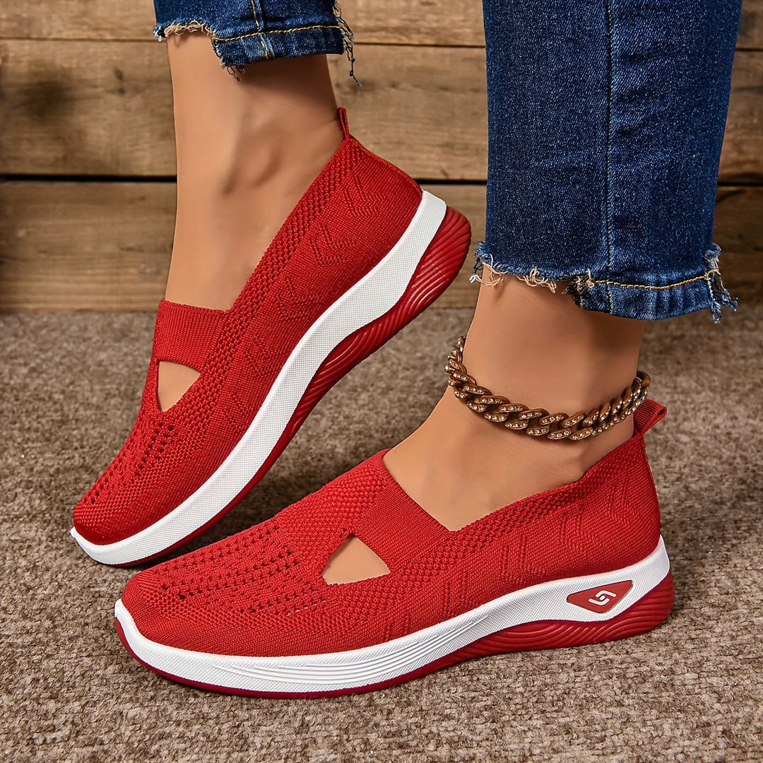 Overhead view of slip-on orthopedic sneakers displaying stretch knit upper and removable insole