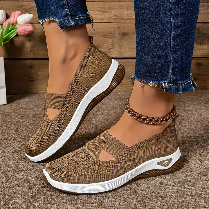 Women's platform sneakers with non-slip sole worn with casual denim jeans