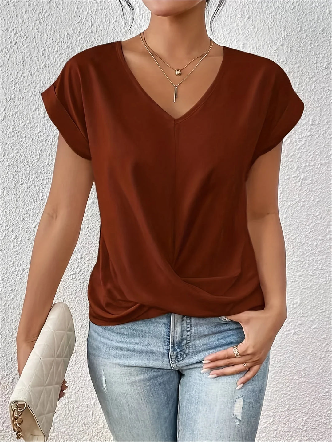 Women's twist front tee in dusty rose paired with denim for casual everyday wear