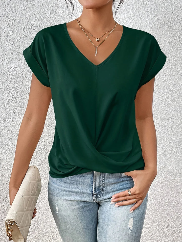 Detail of twist front hem on women's relaxed fit V neck short sleeve tee