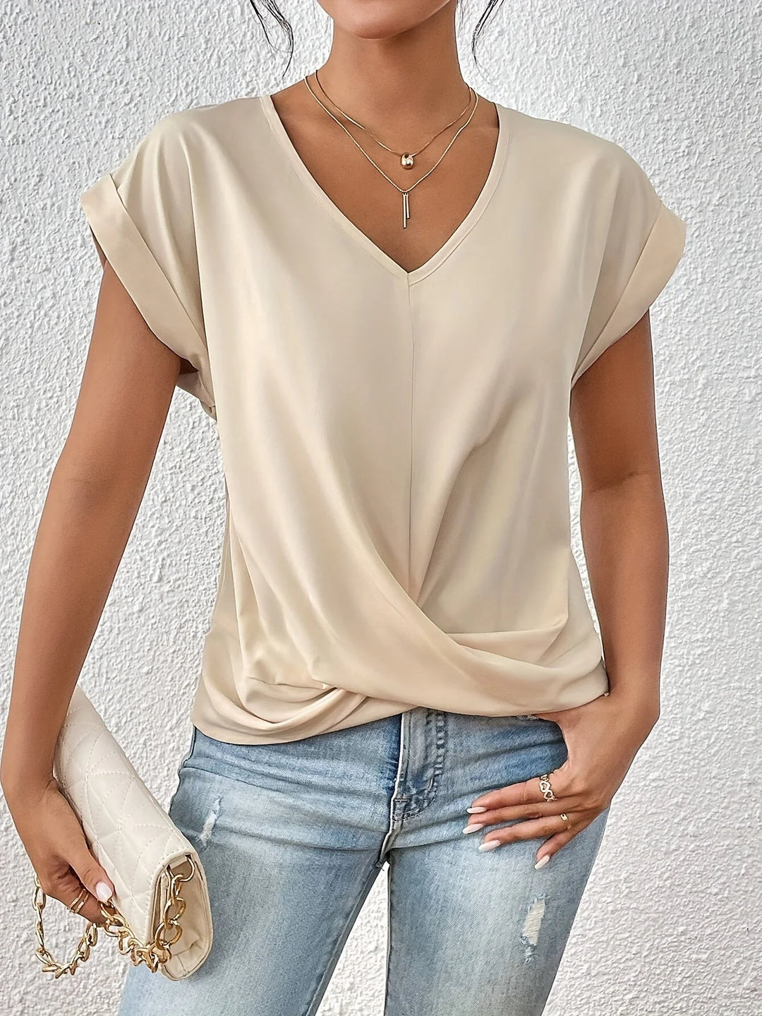 Women's V neck tee in dusty rose showing flattering twist front and comfortable silhouette