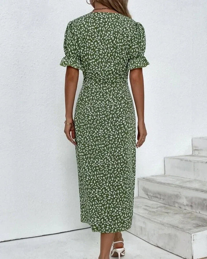 Back view of the floral midi dress showing the wrap-style construction