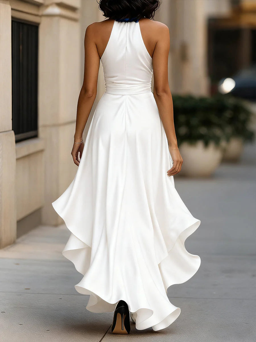Model wearing halter neck ruffle maxi dress walking showing fabric drape and movement