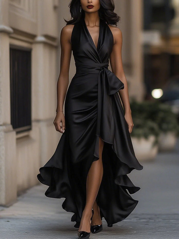 Halter neck ruffle maxi dress back view showing open shoulders and flowing skirt