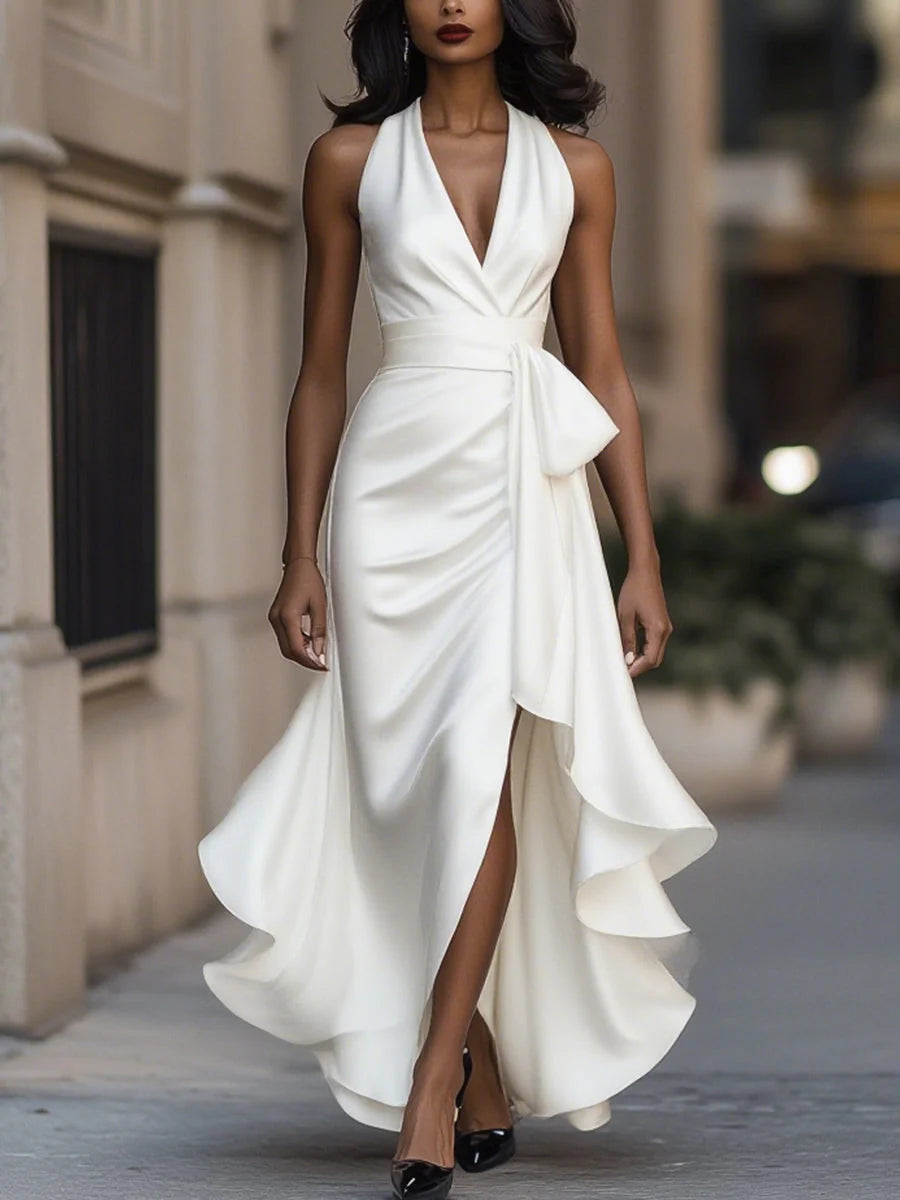 Halter neck ruffle maxi dress in navy showing plunging neckline and floor-length silhouette