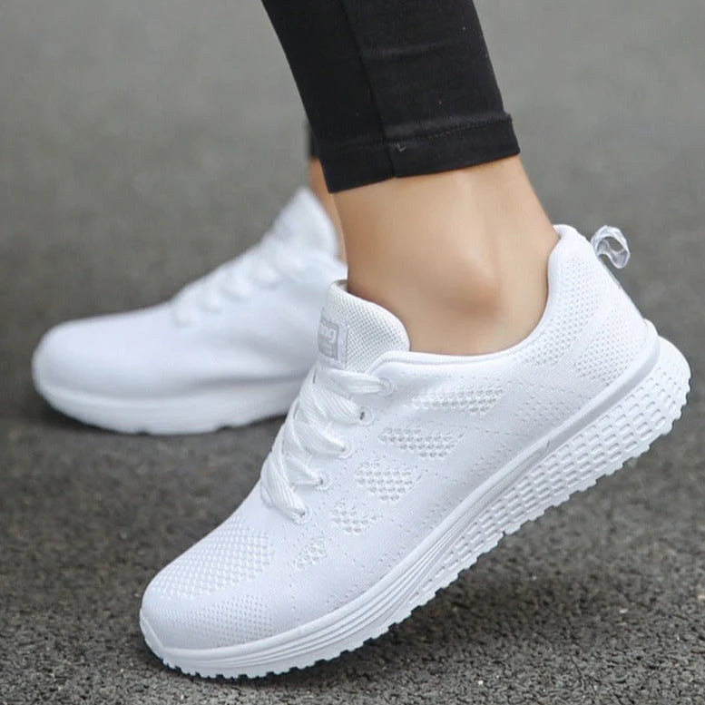 Side view of women's mesh walking shoes featuring wide toe box and shock-absorbing sole for all-day wear