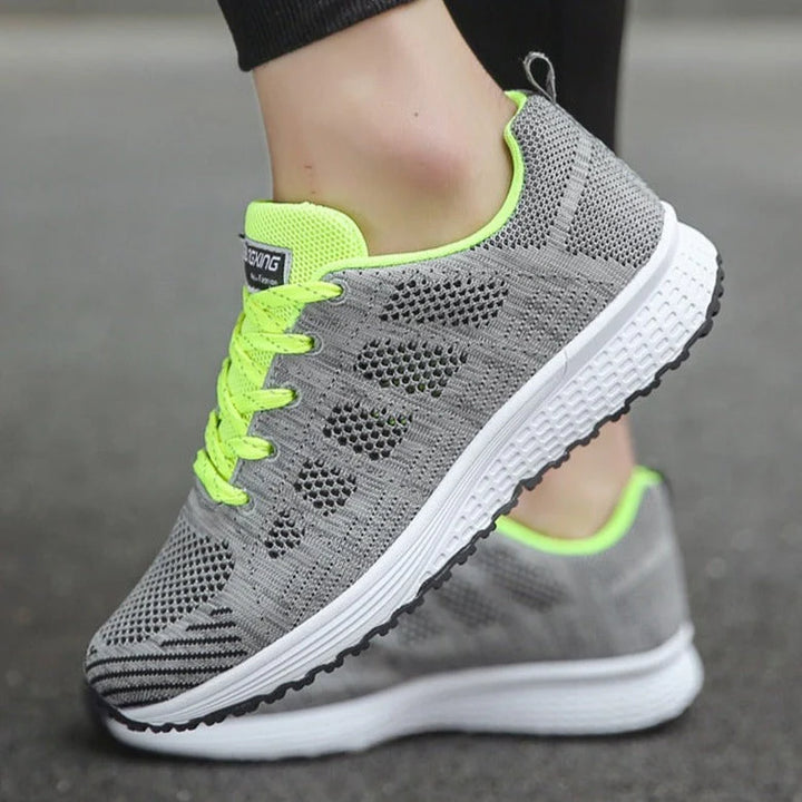 Close-up of orthopedic sneaker upper showing soft knit mesh material and supportive arch design