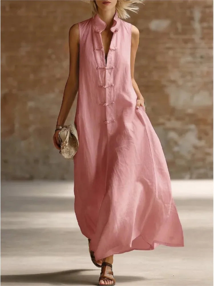 Side view of sleeveless maxi dress showing loose fit and ankle-length hemline