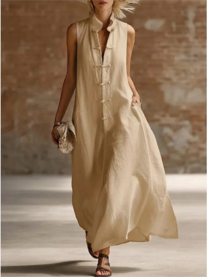 Full-length sleeveless maxi dress styled with sandals for casual summer wear