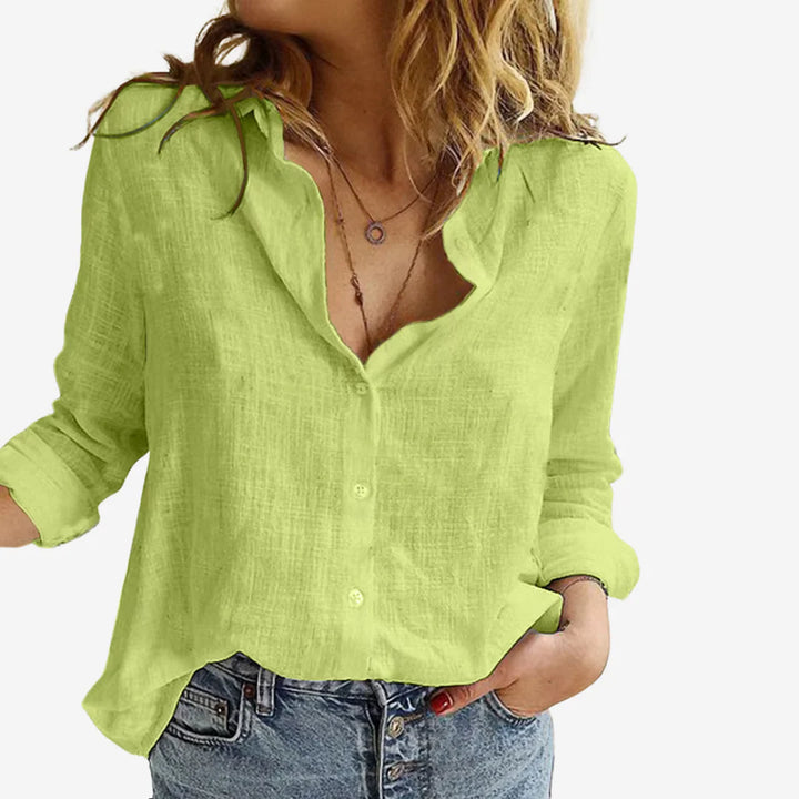 Woman styling Women's Linen-Blend Blouse with sleeves rolled up and collar open for casual look