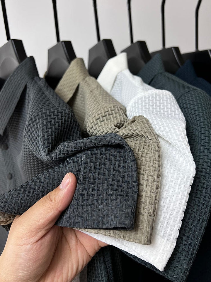 Men's button-up polo shirt in gray displaying breathable mesh construction