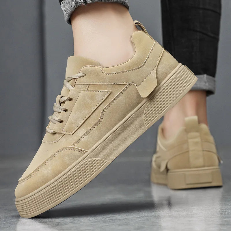 Side view of men's taupe low-top sneakers showing textured rubber outsole and padded collar