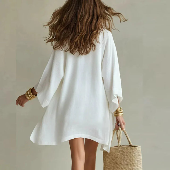 Side angle showing the flowing open cardigan and relaxed silhouette of the linen co-ord set