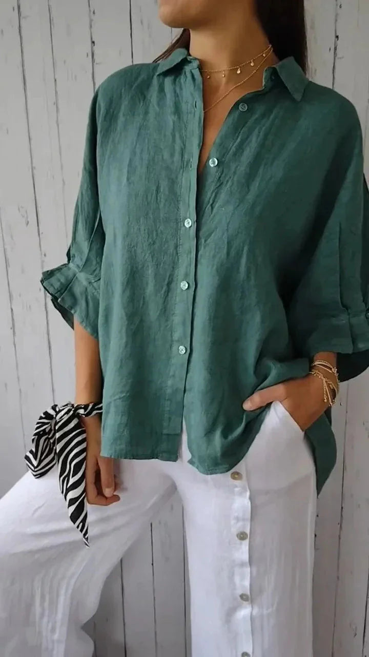Women's casual blouse in neutral olive shade featuring rolled sleeve tabs and natural drape