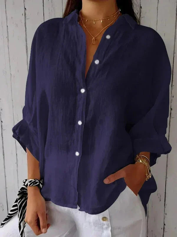 Back view of linen blouse showing slit detail with decorative tie accent